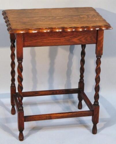 A 1920s oak sewing table