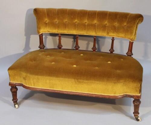 An Edwardian mahogany nursing settee