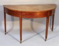 A George III mahogany 'D'-end table