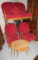 A nest of three Ercol light wood tables