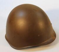 A post war steel infantry helmet.