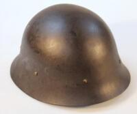 A WWII period steel helmet.