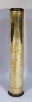 A 120mm brass anti-tank shell case.