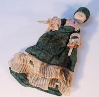 A wooden pegged doll