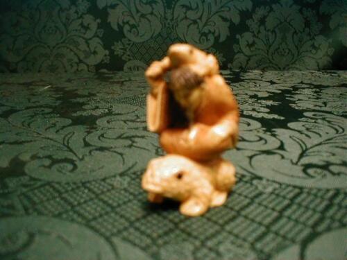 A Japanese ivory netsuke a study of the famed immortal Gama Sennin seated