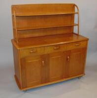 An Ercol light elm dresser