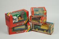 A collection of Britains model farm vehicles