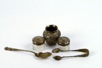 A presentation silver teaspoon and sugar bows