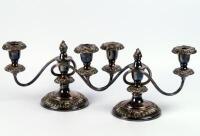 A pair of silver plated two branch candelabra