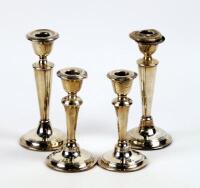 Two pairs of modern silver candlesticks