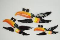Three graduated Guinness flying toucan wall plaques