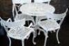A modern cast aluminium circular garden table