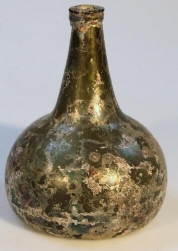 An early 18thC opalescent green glass bottle