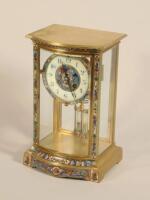 A 20thC brass and champleve enamel four glass mantel clock