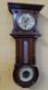 A late 19thC/early 20thC German walnut clock combined with a barometer and thermometer