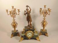 A late 19thC French spelter and marble clock garniture