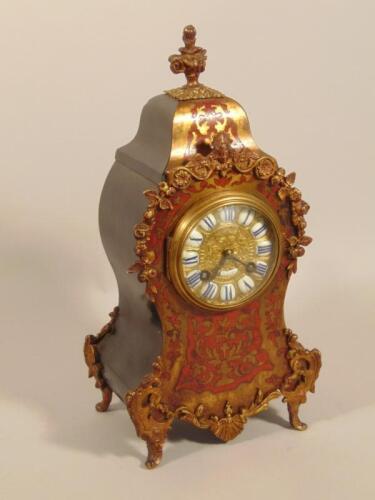 A late 19thC French style red Boulle and ebonised mantel clock