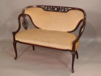 A late Victorian mahogany salon settee