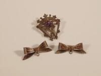 Three brooches