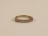 An 18ct white half hoop eternity ring