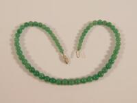 A graduated jade necklace