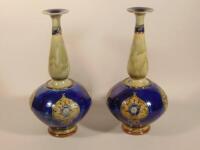 A pair of Royal Doulton bottle shaped stoneware vases