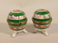 A pair of Continental porcelain egg shaped boxes and covers