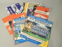 A large quantity of various football programmes