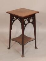 An Edwardian oak occasional table