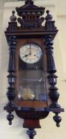 A late 19thC Vienna style walnut wall clock