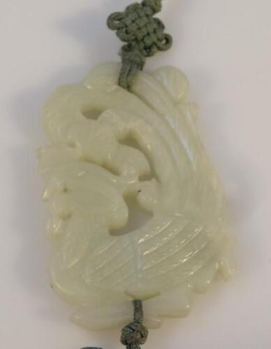 A Chinese pale green jade pendant