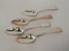 A set of four William IV silver Fiddle pattern serving spoons