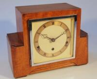 An Art Deco walnut cased mantel clock