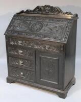 A late 19th/early 20thC dark oak bureau