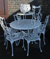 A cast aluminium framed patio set