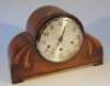 A 1950's oak cased mantel clock