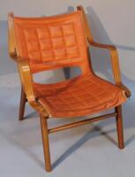 A Danish Fritz Hansen beech and teak framed armchair