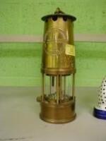 A brass Miners lamp.