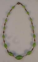 An olive green jade finish necklace