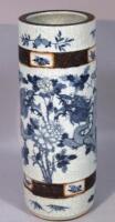 A Chinese earthenware blue and white crackle glazed umbrella stand