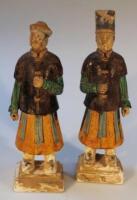 A matched pair of Chinese stoneware temple figures