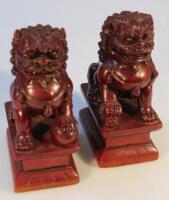 A pair of Chinese lacquer Dog of Fo figures