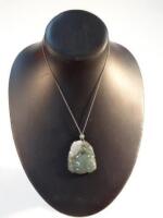 A green jade pendant