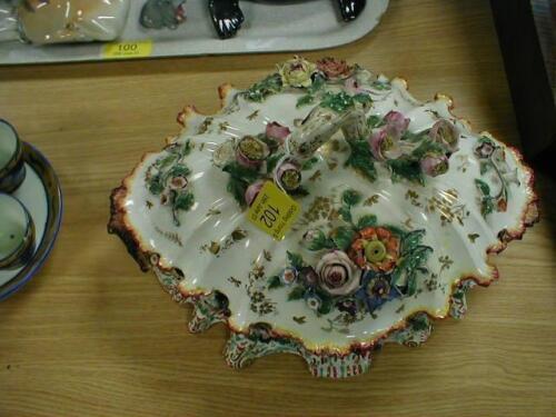 A Victorian porcelain ink stand of gilt and floral encrusted scalloped form