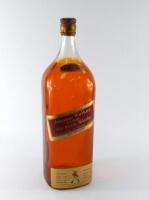 A mid 20thC Johnny Walker Red Label Old Scotch Whisky display bottle