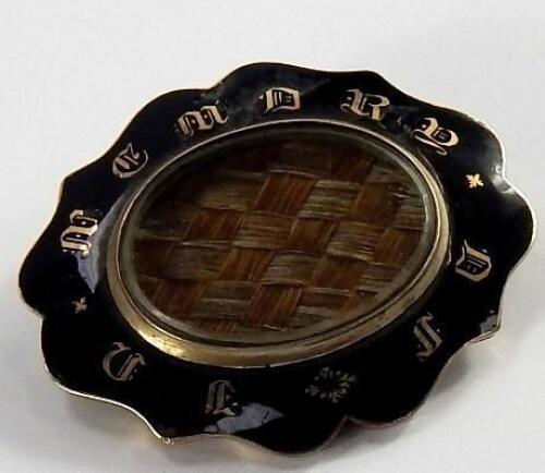 A Victorian enamelled memorial brooch