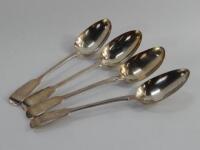 A set of four George III silver fiddle pattern table spoons