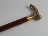 A mid 20thC brass handled sectional walking stick