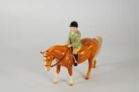 A Beswick young rider upon horse