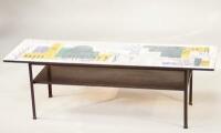 A mid 20thC printed Formica topped coffee table